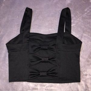 Cropped black top with an open bow back, shirt